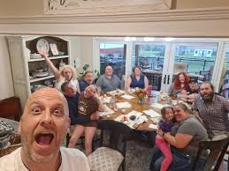 Family gathered around a dinner table celebrating together